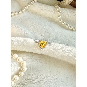 Emerald green elongated radiant cut cocktail ring